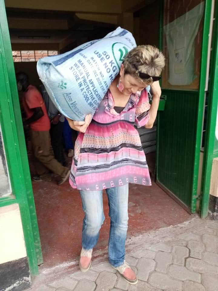 Community catalyst carrying bags of maize